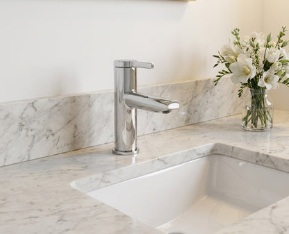 Modern kitchen sink with faucet on a marble countertop