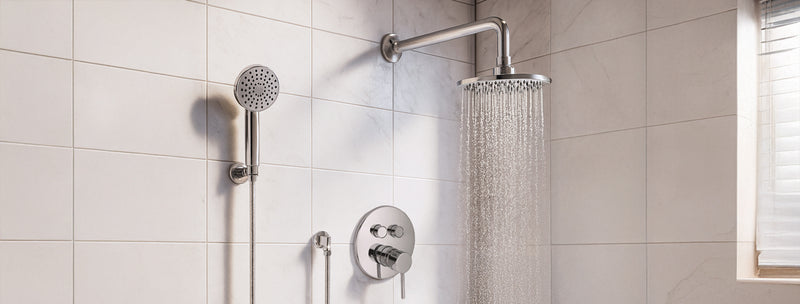 Shower head and control panel on a tiled shower wall